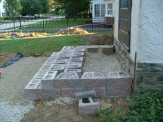 a cement block sitting in the middle of a yard