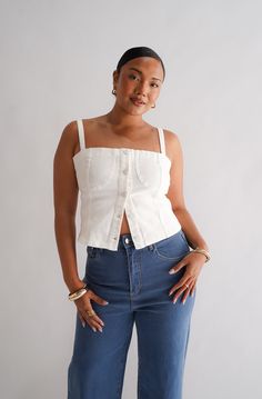 Denim on denim is making a comeback with our Siren Denim Top white out! A new take on our previous design, with matching stitching to compliment this wear-on-repeat item. A top made to be seen - wear this one with any of your denim pieces in your wardrobe for the ultimate cool girl vibe! With a flattering straight neckline and adjustable shoulder straps, this structured top will be a timeless piece in your wardrobe. Why you'll love this: Take her from the office to drinks with no fuss, she is th Casual White Cotton Denim Top, Medium Wash Cotton Tops For Everyday, White Denim Top For Spring, White Casual Denim Top For Spring, White Cotton Denim Top For Summer, White Casual Denim Top For Summer, White Denim Jeans For Day Out, White Trendy Denim Top For Spring, Trendy White Denim Top For Spring