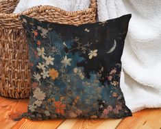 a pillow sitting on top of a wooden floor next to a basket