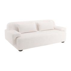 a white couch with pillows on it