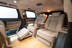 the interior of a luxury vehicle with leather seats