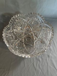 a glass bowl sitting on top of a table