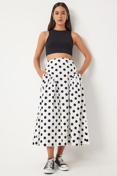 Description:Step out in style with our eye-catching polka dot high-waisted midi skirt. This playful and chic skirt features a classic black and white polka dot pattern, a flattering high-waist fit, and convenient pockets. Paired with a cropped top or a casual blouse, it’s perfect for any occasion, from casual outings to stylish get-togethers. Features: • Color: Black with white polka dots • High-waisted midi skirt • Classic polka dot pattern • Flattering A-line silhouette • Convenient side pockets • Made from high-quality, breathable fabric for all-day comfort • Versatile styling options for casual and semi-formal events Care Instructions: • Hand wash in cold water or machine wash on a gentle cycle • Use mild detergent • Do not bleach • Hang to dry or lay flat • Iron on low heat if necessa Polka Dot Midi Skirt Outfit, Uga Gameday Outfit, Uga Gameday, Black Polka Dot Skirt, Moon Board, Gameday Outfits, Drop Waist Skirt, Polka Dot Midi Skirt, Chic Skirt