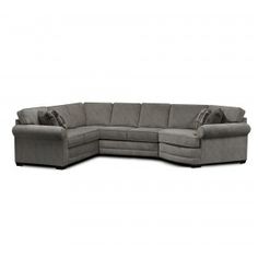 a large sectional couch with pillows on the top and bottom corner, in grey fabric