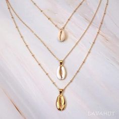 Always designed in Hawaii at Lavahut! Cowry Seashell Layered Hawaiian Necklace  #islandearrings #seashelljewelry #seashellnecklace #hawaiianjewelry #tropicaljewelry #seashellbracelets #tropicalearrings #shesellsseashellsbytheseashore #seashellearrings #islandjewelry Chains Layered, Hawaiian Bracelets, Hawaiian Necklace, Seashell Bracelet, Tropical Earrings, Tropical Jewelry, Three Necklaces, Island Jewelry, Seashell Pendants