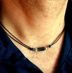 A stylish and laconic choker necklace for men with a faceted black onyx stone bead and stainless steel elements on a thin black cotton cord, stainless steel lobster claw closure. Delicate necklace with natural onyx stone will suit as a casual choker necklace for him. Minimalist surfer style bead cord necklace will be a great gift for him. Necklace length: personalized Black onyx bead: 8 x 5 mm For all products are used only genuine high-quality Italian leather, natural stones and wood. All metal Rope Necklace Men, Male Necklace Diy, Men Leather Necklace, Chokers For Men, Handmade Necklaces For Men, Masculine Jewelry For Men, Diy Mens Necklace Ideas, Necklace Designs Men, Masculine Necklace