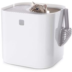 a cat peeks its head out from the top of a white box with mesh handles