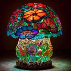 a colorful lamp that is on top of a table