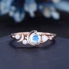 I LOVE YOU TO THE MOON AND BACK RING 5mm Round Natural Rainbow Moonstone Opal Celestial Moon Engagement Ring Cluster Opal Wedding Ring Personalized Handcrafted Birthday Gifts The waning moon is believed to be a good time for clearing negative influences. This simple, ready to wear ring allows you to keep the spirit of the moon with you always. The moon engagement rings are a popular choice, represents I LOVE YOU TO THE MOON AND BACK , used to express the vastness of one's affection for another. 30 days non-hassle return policy. For returned items, there may be handcrafting and shipping fee deducted.  DETAILS: - Material : 925 Sterling Silver (Hypoallergenic, Nickel Free, Tarnish Resistant)Solid 14k/18k gold,platinum PLEASE choose silver or platinum if you are allergic to nickel. - Main sto Crescent Moonstone Ring For Anniversary, Celestial Round Birthstone Ring For Anniversary, Celestial Moonstone Ring With Moon Phase For Anniversary, Celestial Style Round Birthstone Ring For Anniversary, Crescent Moonstone Anniversary Ring, Celestial Crescent Moonstone Ring For Anniversary, Wedding Crescent Moonstone Ring With Moon Phase, Moon Shaped Celestial Moonstone Ring For Anniversary, Crescent Moonstone Jewelry For Anniversary