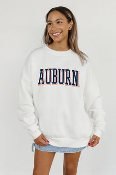 Stand out from the crowd in our Auburn Tigers premium fleece long sleeve sweatshirt. Boasting an oversized fit, crewneck and ribbed knit neckline, wrists, and waistband, it effortlessly blends comfort with fashion. Show your support for your favorite school or team in this irresistibly soft sweatshirt. White Fleece Sweatshirt For College, White Fleece Top For College, White Fleece Tops For College, White Fleece Sweatshirt With Letter Print, White College Sweatshirt For Fall, White Fall College Sweatshirt, White Long Sleeve Sweatshirt For College, White Long Sleeve College Sweatshirt, White Collegiate Sweatshirt For Fall