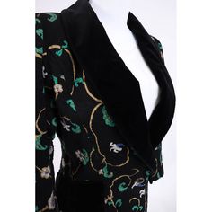 Description: 1990's Ungaro Black Floral Patterned Jacket with Velvet Detail This smoking hot jacket immediately became a shop fave as soon as we saw it on. The cotton floral fabric is gorgeous and the cut is super flattering. Our model said it was really comfortable and she had a blast wearing it We love the gorgeous 90's silhouette with its broad shoulders and tapered hips. Velvet decorative hip pockets are perfectly placed and the plunging velvet neckline lends itself to lots of jewelry layeri Fitted Floral Print Blazer For Winter, Fitted Floral Print Winter Blazer, Fitted Silk Blazer With Floral Print, Silk Long Sleeve Blazer With Floral Print, Fitted Luxury Velvet Outerwear, Luxury Embroidered Retro Outerwear, Fitted Vintage Blazer With Floral Print, Fitted Vintage Floral Print Blazer, Vintage Fitted Floral Print Blazer