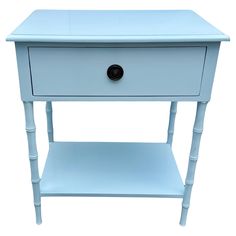 a small blue table with one drawer on the bottom and two drawers on the top