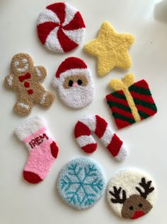 knitted christmas stocking ornaments on a white surface