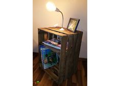 a wooden shelf with a lamp on top of it