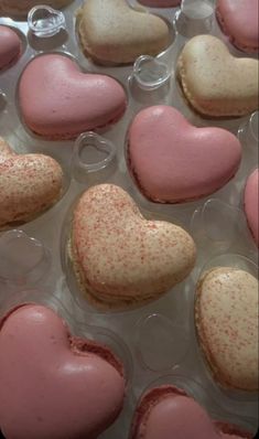 several heart shaped cookies in plastic containers