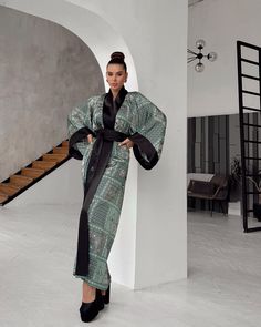 This oriental print long kimono robe showcases a stunning green bohemian kimono design with intricate, traditional patterns in rich shades of green, white, and black. The robe's wide, flowing bell sleeves and solid black satin trim add a touch of elegance to the overall silhouette. This maxi silk women bathrobe drapes beautifully, offering both comfort and luxury. Ideal as elegant nightwear, this robe combines style and sophistication, making it perfect for special occasions or lounging in refined comfort.  ◌ SIZE: - One size xs-l  - Robe length - 55" (140 cm) - Sleeve length - 16.5" (42 cm) - Width - 47.2" (120 cm) ◌ MATERIALS: - 100 % silk & satin ◌ This Oriental kimono robe is perfect for all seasons ◌ CARE INSTRUCTIONS: 1) Machine or hand wash on delicate mode. 2) Minimal light spinnin Luxury Black Long Sleeve Robe, Bath Robes For Women, Bohemian Kimono, Satin Noir, Kimono Design, Long Kimono, Womens Robes, Dress Maxi, Bell Sleeve Dress