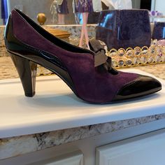 Nwt Liz Claiborne Purple Suede W/ Black Patent Tie Closed Toe Heels 8 3” Heels Brand New Never Worn Pet And Smoke Free Home Chic Purple Leather Heels, Elegant Purple Heels For Office, Purple Leather Pointed Toe Heels, Purple Leather Heels With Pointed Toe, Purple Round Toe Heels For Office, Chic Purple Heels For Formal Occasions, Chic Purple Heels For Formal Events, Fitted Purple Heels For Formal Occasions, Purple Leather Heels Medium Width