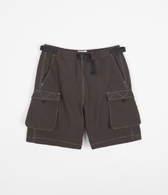 Description Satta Cargo Tech Shorts Satta Cargo Tech Shorts in Charcoal. Inspired by traditional outdoor apparel, these utilitarian Satta cargo shorts are crafted from lightweight technical nylon cloth for a breathable and resilient wear. Tailored to a relaxed fitting, these above-knee shorts feature an elasticated waist, an integrated nylon webbing belt and with colour contrast stitching throughout. Finished with two side entry pockets, two 3D cargo pockets and with two closure gusseted patch p Pilot Uniform, Knee Shorts, Colour Contrast, Webbing Belt, Skateboard Store, Utility Pockets, Khaki Color, Contrast Stitch