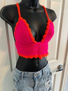 🧡Gorgeous, scalloped pattern cropped crochet top, in a vivid, neon, hot pink and orange duo of colors! 🧡 This shirt GLOWS under black light!  A fun, pop of neon color for your summer! You will stand out in this gorgeous crocheted shirt. Perfect for a summer music festival, farmers market, concert, food festival or just a stunning piece for the boho style. Bright, neon colors are a show stopper! Crocheted top has an intricate scalloped detail band with a stunning diamond style front on the midd Festival Crochet V-neck Crop Top, Trendy Fitted Tops With Crochet Trim, Fitted Orange Tops For Festival, Summer Party Cropped Crochet Top, Summer Fitted Crop Top With Crochet Trim, Trendy Fitted Top With Crochet Lace, Trendy Fitted Tops With Crochet Lace, Trendy Fitted Crochet Lace Top, Fitted Crochet V-neck Crop Top