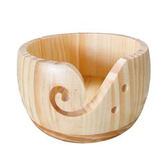 a wooden bowl that is shaped like a snail