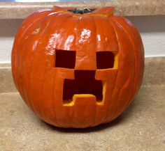 a carved pumpkin that has been cut into the shape of a face with two holes in it