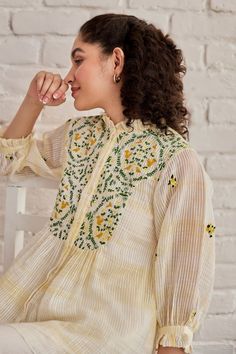 Yellow top featuring blossom hand embroidered yoke and sleeves with ruffle neck. Comes with an inner. - Aza Fashions Yellow Long Sleeve Top With Chikankari Embroidery, Yellow Long Sleeve Top With Resham Embroidery, Yellow Resham Embroidery Top For Spring, Spring Yellow Tops With Resham Embroidery, Yellow Chikankari Embroidery Top For Spring, Yellow Tops With Chikankari Embroidery For Spring, Traditional Ruffled Tops For Festive Occasions, Festive Traditional Ruffled Tops, Festive Spring Blouse With Chikankari Embroidery