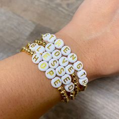 Get ready to feel #blessed with our BLESSED Beaded Bracelet! Featuring 6 white circles with gold tone lettering, this 4mm gold beaded stretch bracelet will add a touch of whimsy and positivity to any day. Spread good vibes and style with this feel-good accessory. Approximately 6.5" Plated 18k Gold Brass Base Plastic Letter beads (some imperfections and variance in color will occur) Lettered Bracelets, Gold Stretch Bracelet, Plastic Letters, Tie Headband, Bracelet Ideas, Letter Beads, The Hope, Gold Brass, Inner Strength