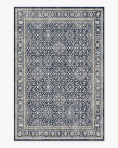 a blue and white rug with an intricate design