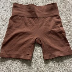 Brown Biker Shorts Size Medium. Never Worn Brown Stretch Workout Shorts, Stretch Brown Workout Shorts, Brown Stretch Sports Shorts, Brown Stretch Shorts For Sports, Stretch Brown Sports Shorts, Sporty Brown Bottoms With Short Leg, Sporty Brown Short Leg Bottoms, Sporty Stretch Brown Shorts, Sporty Brown Shorts