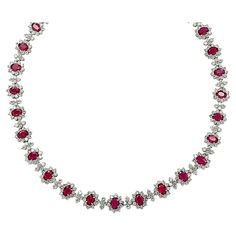 Sensational Diamond and Ruby necklace finely crafted in platinum, featuring Red Burma Rubies and white diamonds weighing approximately 47.25 carats total. This exceptional necklace showcases 406 round brilliant cut diamonds weighing 21.79 carats total, H-I color, VS2-SI1 clarity, 29 Oval Burma Rubies weighing 25.46 carats total. The white diamonds are placed beautifully around the red Burma Rubies capturing the unparalleled beauty of nature. The infinite attention to detail continues to the hidden box clasp, which is adorned with a oval Burma Ruby and white round brilliant cut diamonds. This gorgeous necklace measures 16.25 inches in length, 10.6 mm in width, and weighs 59.1 grams. Our pieces are all accompanied by an appraisal performed by one of our in-house GIA Graduates. They are also Ruby Diamond Necklace, Ruby Jewelry Necklaces, Ruby And Diamond Necklace, Ruby Necklace, Box Clasp, Expensive Jewelry, Ruby Jewelry, Ruby Diamond, Gorgeous Necklaces