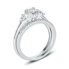 Classic and chic, this diamond bridal set reminds her she's the light of your life. Crafted in sterling silver, the engagement ring features a center diamond - artfully set to enhance size and sparkle - wrapped in a diamond halo frame. Trios of diamonds flank each side and decorate the slender split shank. On your special day, a slim wedding band lined with petite diamonds completes this delightful ensemble. Radiant with 1/4 ct. t.w. of diamonds and a brilliant buffed luster, this bridal set is the start of something beautiful. Custom-made to fit her ring size. Sterling silver rings cannot be resized after purchase. Her Ring, Diamond Frame, Bridesmaid Jewelry Sets, Diamond Bridal Sets, Dream Engagement, Dream Engagement Rings, Sterling Silver Engagement Rings, Rings Wedding, Bridal Set