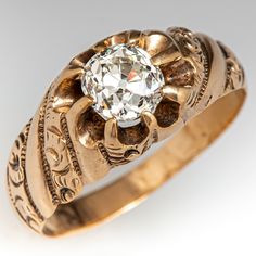 an antique ring with a diamond in the center