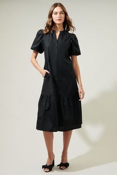 It's easy to dress for the day when you've got a cute look like the Stilwell Short Sleeve Midi Dress! This adorable dress has puffy short sleeves, elastic at the cuffs, and a split neckline. As well as, pockets on each side of the dress atop a functional buttons that runs down to a midi pleated hem. It’s a cute dress to wear with some sandals or heels. - Puffed short sleeves- Button - Side pockets- V-neckline- Comes in 2 colorsSize + Fit - Model is 5'8" and wearing size XS- Measurements taken fr Short Sleeve Midi Dress, Elle Magazine, Midi Short Sleeve Dress, Sleeve Midi Dress, 70 Dress, Cute Dress, Black Midi Dress, Sweater Weather, Quality Clothing