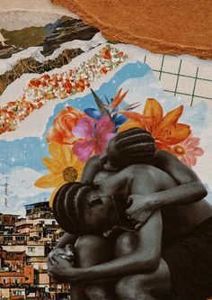 two women hugging each other in front of a mural