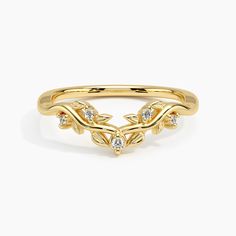 a gold ring with leaves and diamonds on it