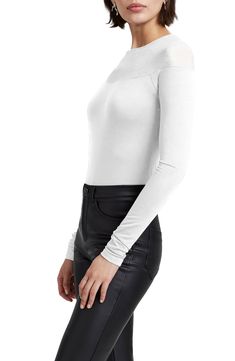 This chic long-sleeve top is made from soft and sustainable jersey and designed with a sheer yoke that easily takes your look from day to night. Crewneck Long sleeves 96% Tencel® lyocell, 4% elastane with 95% viscose, 5% elastane contrast Tencel lyocell is a sustainably produced fiber made with closed-loop processing Machine wash, line dry Imported Stretch Tops With Mesh Sleeves For Fall, Stretch Crew Neck Long Sleeve Top For Night Out, Fall Tops With Sheer Sleeves And Stretch, Fall Tops With Sheer Sleeves And Stretch Fit, Fall Stretch Tops With Sheer Sleeves, Sheer Sleeve Stretch Tops For Layering, Chic Long Sleeve Stretch Top, Fitted Long Sleeve Mesh Top For Fall, Solid Color Sheer Long Sleeve Tops