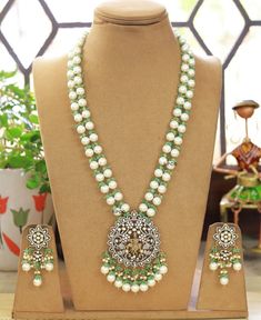 Temple Jewelry necklace of Pearl and Beads with matching earrings Perfect for any kind of occasions and ceremonies. You can wear it with Saree lehenga and Evening Gowns. Highest quality and craftsmanship. Arrives in box Please let me know if you have any questions White Temple Jewelry Beaded Necklaces For Wedding, Green Pearl Chain Necklace For Wedding, White Temple Jewelry Beaded Necklace For Wedding, Temple Jewelry Necklace With Matching Earrings For Wedding, Silver Pearl Drop Jewelry For Reception, Green Pearl Necklace For Wedding, Wedding Pearl Necklace With Polished Beads, Temple Jewelry Style Pearl Necklaces For Receptions, White Kundan Necklace With Matching Earrings For Wedding