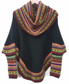 Superfine Alpaca turtleneck poncho, made of the finest alpaca. Sweater alpaca soft and warm, this is a versatile garment, ideal for cold winter seasons. It displays a casual design with andean designs and colors bright. -Goes with just about everything.-Get complimented every time you wear it.-With ethnic figures design on the top.-Unique and stylish.Material: Alpaca Wool. Alpaca Wool is hypoallergenic, light and warm. Its fibers contain microscopic air bags that make the garments light and deli Black Alpaca Poncho For Winter, Oversized Alpaca Poncho For Winter, Black Alpaca Shawl For Winter, Cozy Alpaca Poncho For Winter, Cozy Alpaca Cape For Winter, Cozy Long Sleeve Wool Cape, Black Alpaca Shawl Poncho, Casual Alpaca Poncho For Winter, Black Alpaca Cape For Winter