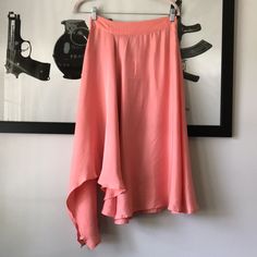 Suncoo Fleur Midi Skirt In Rose....Size T1 Or S. Ruffled Asymmetric Midi Skit Ruffled Midi Skirt, Asymmetric On The Side, Fluid Fabric In Cupro And Lyocell, Zippered Closing On The Side, Waistband. Flowing Slinky Matte Satin; 60% Cupro, 40% Lyocell. Waist Across 13.25". Length 23" At Shortest And 36" At Longest. New With Tag. C Summer Flowy Flared Draped Skirt, Summer Draped Skirt With Asymmetrical Hem, Summer Asymmetrical Draped Relaxed Skirt, Summer Maxi Skirt With Handkerchief Hem, Summer Asymmetrical Maxi Skirt With Lining, Spring Maxi Skirt With Asymmetrical Hem, Summer Fitted Draped Skirt With Asymmetrical Hem, Summer Flowy Handkerchief Hem Skirt, Summer Asymmetrical Draped Lined Skirt