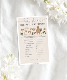 the price is right printable baby shower game with white flowers and greenery around it