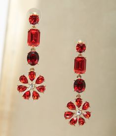 These dazzling drop earrings boast shimmering red rhinestones set in golden hardware in a tiered design with a floral pendant. Complete with post backs. Available while supplies last. Earrings Western, Floral Pendant, Earrings Red, Red Earrings, Red Rhinestone, Big Earrings, Green Glitter, Red Wedding, Wedding Earrings