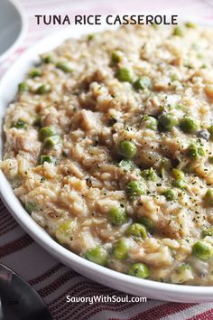 a white bowl filled with rice and peas