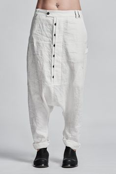 "Off-White Drop Crotch Boiled Linen Trousers with Buttons__ // EXPRESS DELIVERY ONLY __Semi Visible Front Closure with Black Buttons __3 Front & 2 Back Pockets __Fully Completed Bound Seams __Elastic Backside Waistband model__ bust 92 (36\"), waist 72 (28\"), hips 102 (40\"), biceps 28 (11''), height 177 (5'8\"), kg 65 (143 lbs) model wears size M | color: off-white fabric__ 100 linen care__ dry cleaning do not bleach do not tumble dry do not iron to keep wrinkle effect sizing__ size XS (US White Cotton Tapered Leg Harem Pants, White Straight Leg Harem Pants With Pockets, White Straight Leg Pants With Button Closure, White Fitted Cotton Harem Pants, White Cotton Straight Leg Harem Pants, White Relaxed Fit Harem Pants With Straight Leg, White Harem Pants With Pockets And Loose Fit, Fitted White Harem Pants With Pockets, White Cotton Harem Pants With Pockets