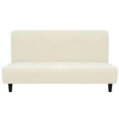 a white couch sitting on top of a wooden floor