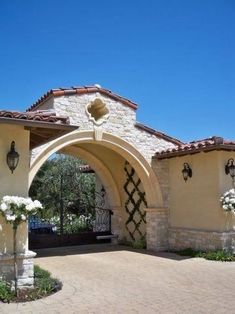 an entrance to a home with white flowers