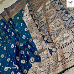 Discover timeless elegance with our exquisite Indian Traditional  Banarasi Satin Silk Saree.   Crafted with precision on traditional handlooms, this saree with a brocade blouse that complements its classic charm.  The very soft and smooth fabric drapes gracefully, enhancing your silhouette with every step.  The premium quality zari weaving lends a luxurious touch, showcasing the mastery of skilled artisans who have woven their magic into every thread. Embrace the heritage of Banarasi craftsmanship and make a statement at weddings, festivals, or cultural gatherings.  Elevate your style with this embodiment of Indian tradition, where every detail tells a story of craftsmanship, passion, and timeless beauty. Indulge in the allure of tradition and sophistication with our Red Banarasi Katan Sil Festive Traditional Wear With Traditional Fit And Drape, Blue Katan Silk Ceremonial Traditional Wear, Ceremonial Traditional Wear With Traditional Patterns, Ceremonial Blue Katan Silk Traditional Wear, Diwali Traditional Wear With Traditional Patterns, Banarasi Silk Traditional Wear For Wedding, Traditional Katan Silk Saree For Ceremonial Occasions, Fitted Traditional Wear With Motifs, Elegant Ceremonial Saree Blouse Piece