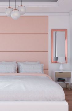 a bedroom with a pink headboard and white bedding, two nightstands on either side