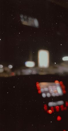 blurry image of cars at night in the dark