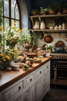 a kitchen filled with lots of pots and pans on top of a wooden counter