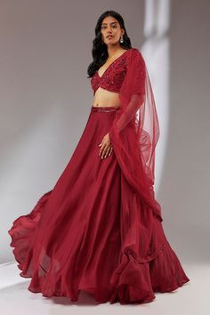 Red lehenga crafted in satin with embroidered waistband and attached cancan. Comes with embroidered padded blouse and dupatta.
Component: 3
Pattern: Embroidery
Type Of Work: Sequins, Cutdana, Moti
Neckline: Plunge V
Sleeve Type: Half
Fabric: Satin, Net, Organza, Lining: Cotton Shantoon
Color: Red
Other Details: 
Fitted at bust and waist
Open back
Occasion: Wedding - Aza Fashions Silk Lehenga With Dori Work For Party, Bollywood Style Evening Organza Sets, Bollywood Style Organza Evening Sets, Red Embellished Party Wear Lehenga, Red Embellished Party Wear Choli, Red Embellished Organza Sets, Red Embellished Party Wear Set, Embellished Red Choli For Party Wear, Embellished Red Party Wear Choli